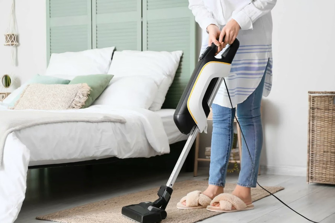 Bedroom vacuuming during a residential clean